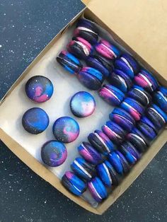 a box filled with marbles sitting on top of a table