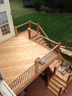 an overhead view of a wooden deck and stairs