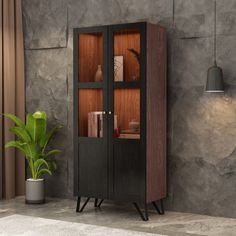 a wooden cabinet sitting next to a potted plant on top of a stone floor