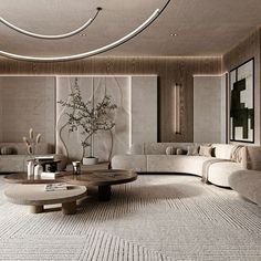 a living room with couches, tables and vases on the table in front of it