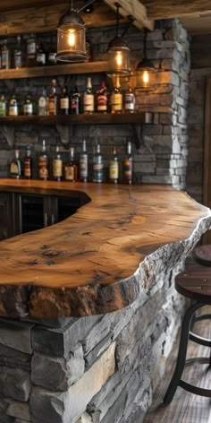 a stone bar with two stools next to it