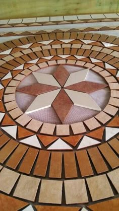 a circular design made out of different colored bricks