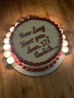 a birthday cake with candles around it that says how long have you been?