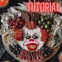 an image of a creepy face made out of food on a plate with candles and fruit