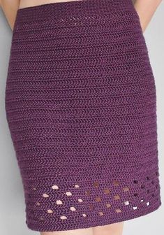 a woman wearing a purple crochet skirt