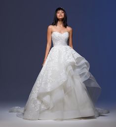 a woman in a white wedding dress on a blue background