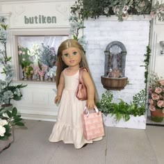 a doll is standing in front of a flower shop with her handbag and purse