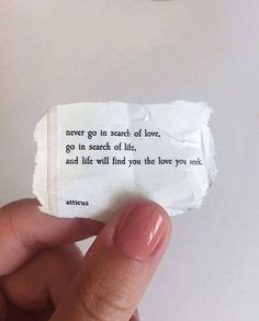 someone is holding up a piece of paper that says never go in search of love, go in search of life