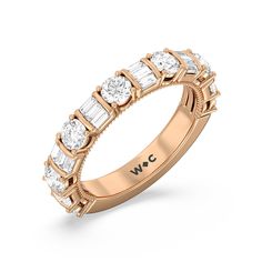 a rose gold wedding band with baguettes and diamonds on the side, set in 18k yellow gold