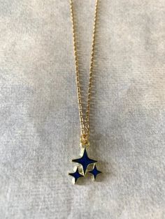 "Dainty, attractive and unique gold tone and blue polar stars necklace. Pendant is small measuring 1/2\" L X 1/2\" W and is on an 18\" chain. ★ Want to see more? Please visit my shop at: https://www.etsy.com/shop/DesignsByPeg" Blue Star Necklace, Gold Star Jewelry, Etsy Jewelry Necklace, Star Necklaces, Freetime Activities, Stars Jewelry, Stars Necklace, Saint Marys, Jewelry Accessories Ideas