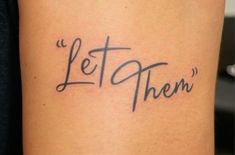 a tattoo that says let them on it