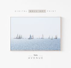 a group of sailboats floating in the ocean on a white background with text that reads digital wall art print