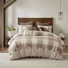 a bed in a room with a wooden headboard and white rug on the floor