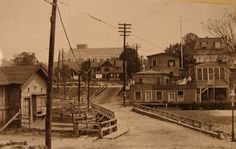 an old black and white photo of some houses