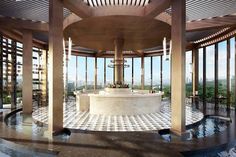 an outdoor gazebo with a fountain in the middle and lots of windows on both sides