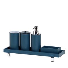 a blue bathroom set with three soap dispensers