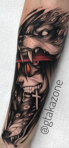 a man's arm with a skull and cross on it