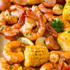 shrimp and corn on the cob with parsley