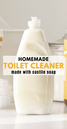 homemade toilet cleaner made with castle soap on a counter next to other bathroom products and accessories