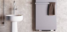 a bathroom with a sink, mirror and towel rack on the wall next to it