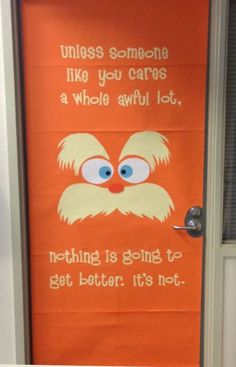 an orange door with a sign that says unless someone like you cares a whole awful lot, nothing is going to get better it's not