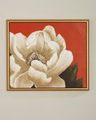 a large white flower on a red background in a gold frame hanging on a wall