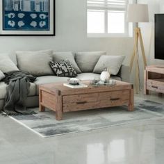 a living room filled with furniture and a flat screen tv on top of a wooden table