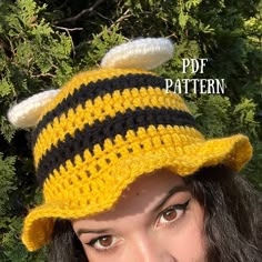 a woman wearing a crocheted bee hat