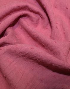 the pink fabric is very soft and has small dots on it's surface,