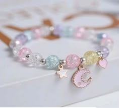 Pretty Crescent Moon and Star Ramadan and Eid Bracelet for Girls Give your little one a special gift this Ramadan and Eid with our glowing Pretty Crescent Moon and Star Bracelet! Adorned with intricate and vibrant detailing, this bracelet will glimmer with your little one's joy and have them feeling like a star! Our quality beads will ensure the bracelet stands the test of time, for a gift that will bring your loved one lasting happiness. Perfect for any occasion, this bracelet will shine with b Girly Bracelets, Cute Jewellery, Pretty Jewelry Necklaces, Bracelet Couple, Bracelet Inspo, Beads Bracelet Design, Jewelry Accessories Ideas, Kids Necklace, Bead Bangles