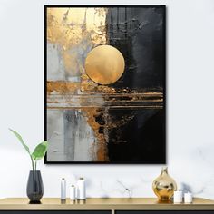 a black and gold abstract painting on a wall