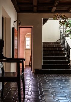 an entryway with stairs leading up to the second floor