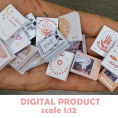 a person's hand holding several small cards with the words digital product sale 11 / 12