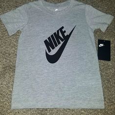 N.W.T. Nike Little Boys Gray And Black Tshirt Nike Athletic Heather Graphic Print Top, Nike Gray Graphic Print Top, Nike Gray T-shirt With Logo Print, Nike Cotton T-shirt In Athletic Heather, Nike Tops In Athletic Heather With Logo Print, Nike Graphic Print T-shirt In Athletic Heather, Nike Athletic Heather T-shirt With Logo, Nike T-shirt In Athletic Heather With Logo Print, Nike Gray Tops With Letter Print