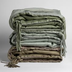 a stack of folded linens on top of each other