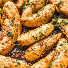 chicken with sauce and herbs in a pan