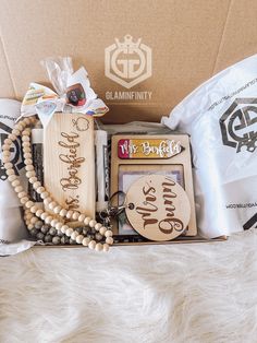 an open box containing items from the glaminfinity collection, including necklaces and bracelets