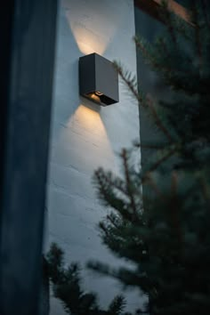 an outdoor light on the side of a building