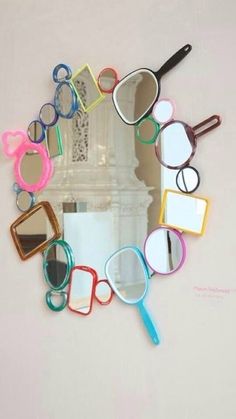 there is a mirror that has many different items in the shape of glasses on it