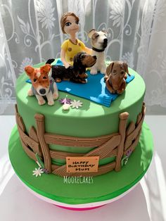 there is a cake with dogs on it