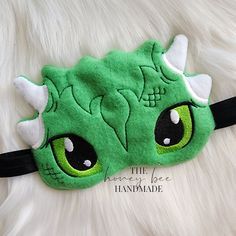 These sleep masks are perfect for those that have trouble sleeping at night.. Block the light out and do it in style! All of our sleep masks are made with super soft minky, fleece, or fun fur! Time to sleep in all day! Or just take a nap with! Also perfect for travel, get those kids to sleep through the long trips 🙂 Mask Measurements Dragon Mask Sizes Child Size: 5.09in x 7.04in Adult Size: 5.83in x 8.06in All items are made by me and can be customized with colors ect. We do custom orders for parties or large groups, please contact us for bulk orders and discounts! If you have any questions, please feel free to contact me! Find me on facebook here: https://www.facebook.com/thehoneybeehandmade Please check out our website for more amazing items! https://www.thehoneybeehandmade.com/ Thanks, Old Dragon, Dragon Mask, Night Mask, Sleep Masks, Trouble Sleeping, Green Dragon, Long Trips, Son Love, Pastel Purple