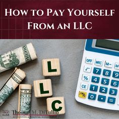 a calculator, stack of money and wooden blocks with the words how to pay yourself from an l c