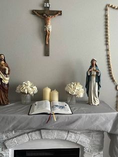 an altar with flowers, candles and crucifix on it