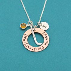 a necklace with two charms on it that says i love you to the moon and back