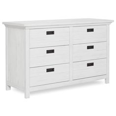 a white dresser with black handles and drawers