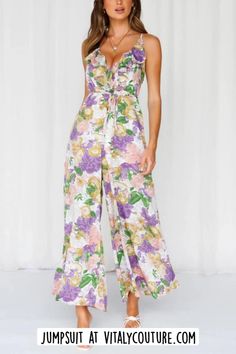 Shop Our Catalog of Women Sets, Rompers & Jumpsuits by Vitaly Couture | Women Outfits | The Floral Print Wide Leg Jumpsuit combines floral charm with contemporary style. Adorned with a vibrant floral print, this jumpsuit radiates a sense of elegance and flair. With its wide-leg silhouette and flattering design, it's a versatile outfit choice that effortlessly transitions from daytime chic to evening glamour, offering a fashionable and comfortable option for various occasions. women fashion sets | skirt and tops | pants and tops | shorts and tops | rompers | rompers for women | denim rompers | chic rompers | classy rompers | jumpsuits for women | classy jumpsuits | date night outfits | date night rompers | date night jumpsuits | fashion for women | chic style | classy style | wpmens outfits Beaded Tie, Chiffon Jumpsuit, Jumpsuit Fitted, Tie Waist Jumpsuit, Print Jumpsuit, Leg Cuffs, Versatile Outfits, Floral Jumpsuit, Print Placement