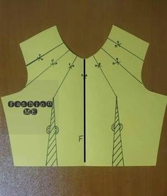 the sewing pattern has been cut out to make a vest for someone's birthday