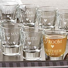 many glasses are lined up on a tray