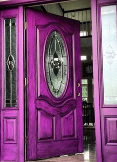 a purple door with two glass panels on it