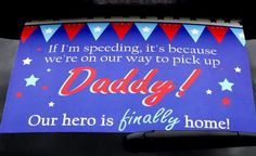 a sign that says daddy our hero is finally home